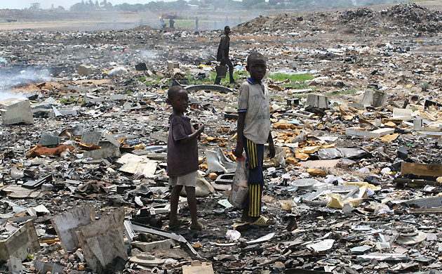 Children playing in electronic waste.