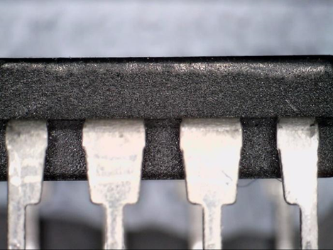 Zoomed in side profile of an electronic component to look for signs of top coating.