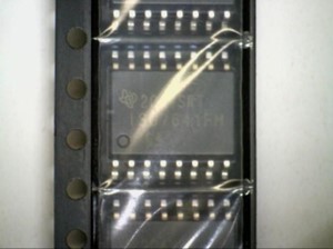 Electronic component in a reel highlighting a large pin one marker.