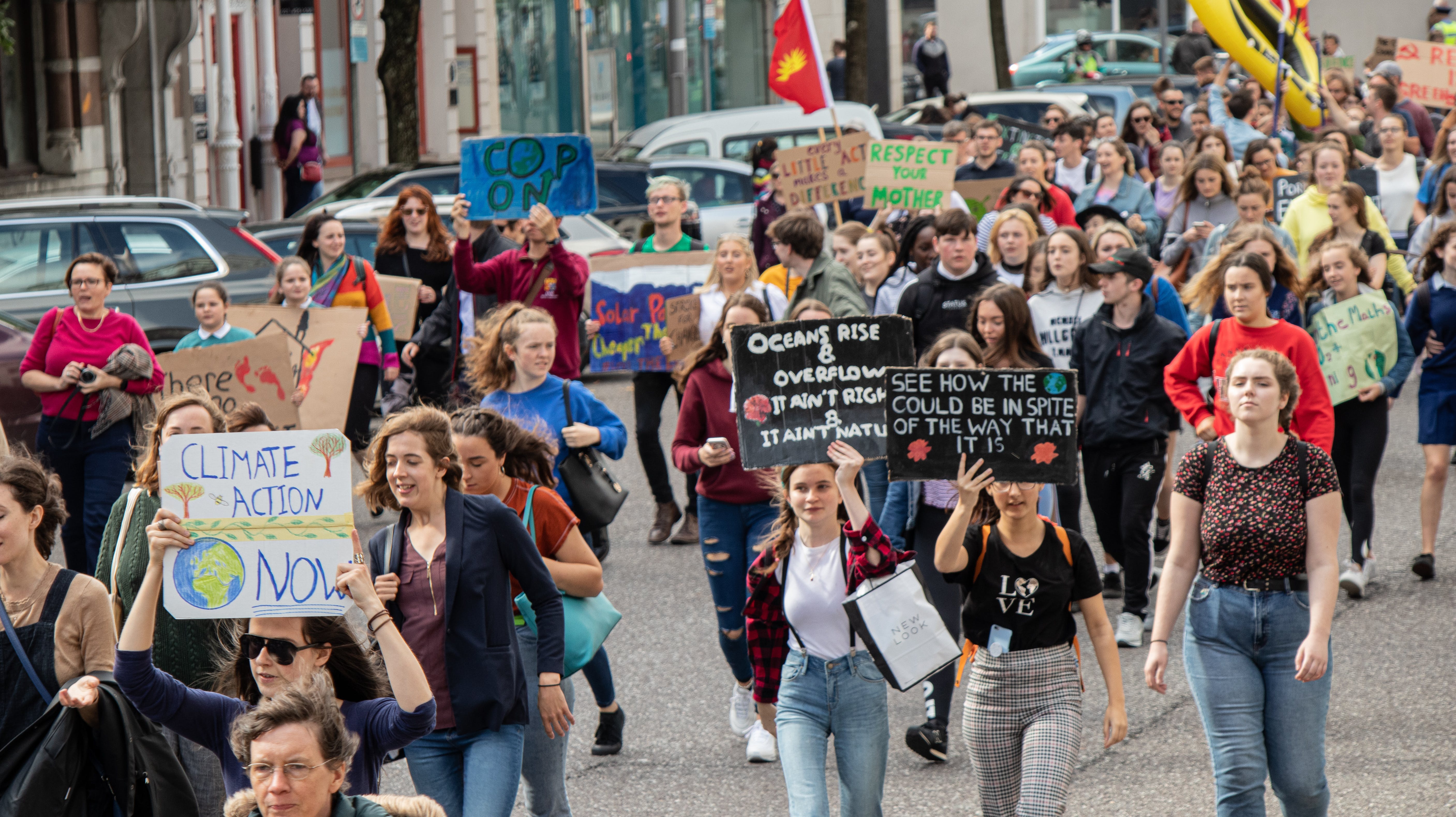 People marching in a climate change rally.