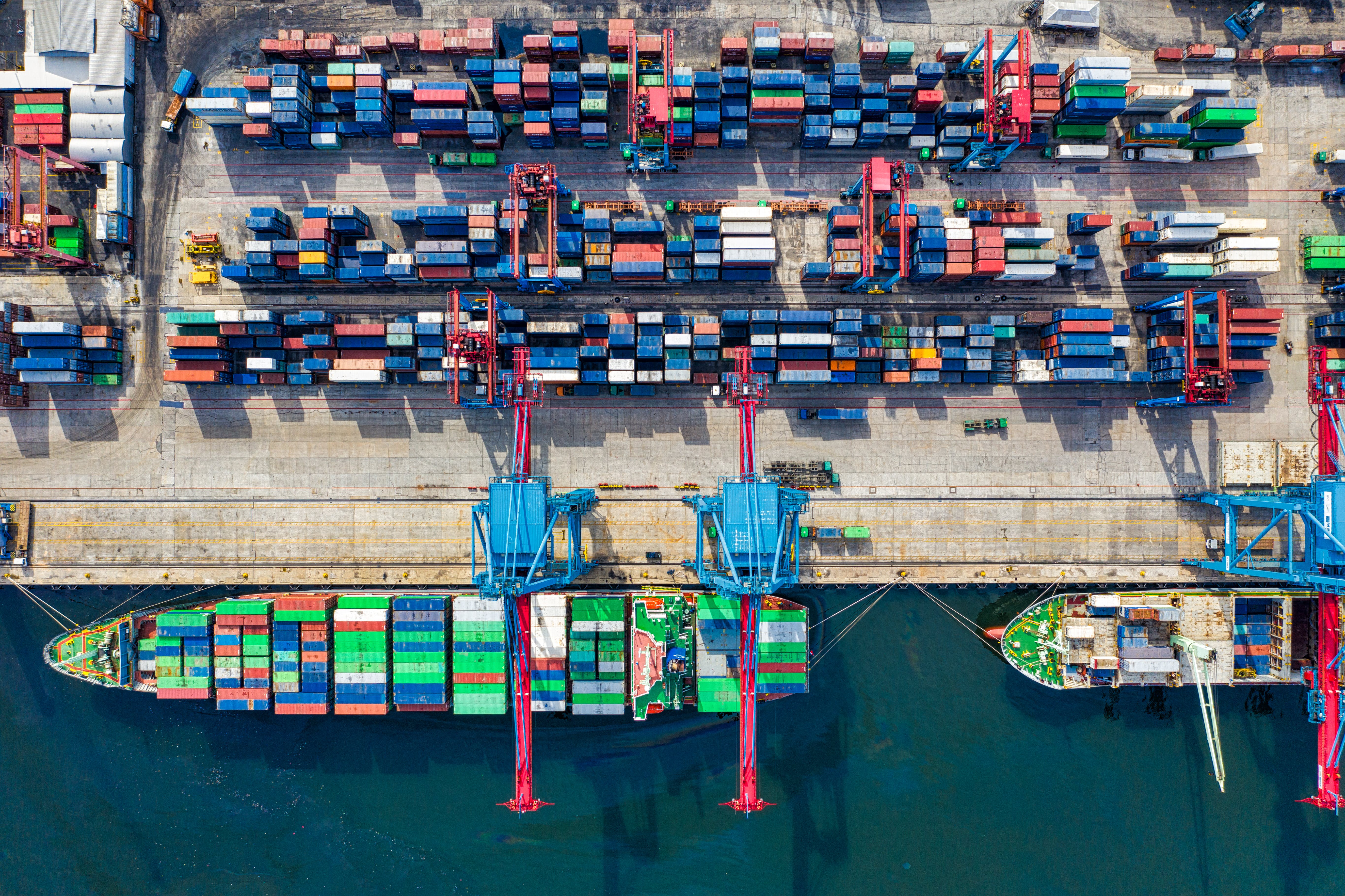 Shipping vessel being loaded up at a port.